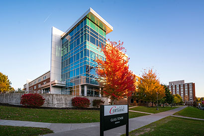 Front of Glass Tower residence hall in the fall